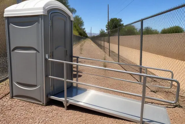 ADA-compliant portable toilet with ramp access on a gravel path in Phoenix, AZ.
