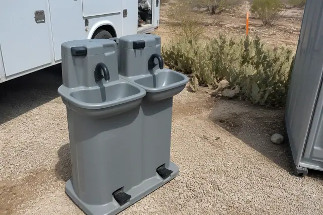 Portable foot-pump handwashing station on a gravel jobsite in Phoenix, AZ.