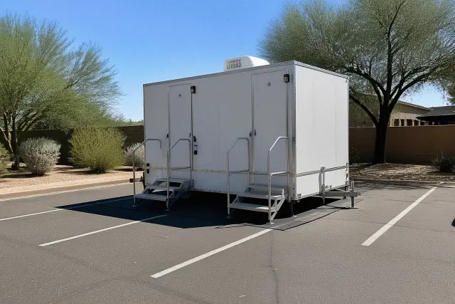 Luxury restroom trailer on leveled asphalt in a parking lot in Phoenix, AZ.