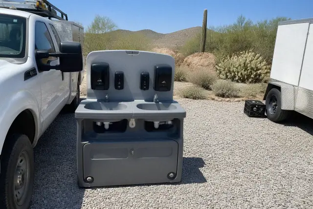 Dual handwashing station units installed on a gravel worksite in Phoenix, AZ.