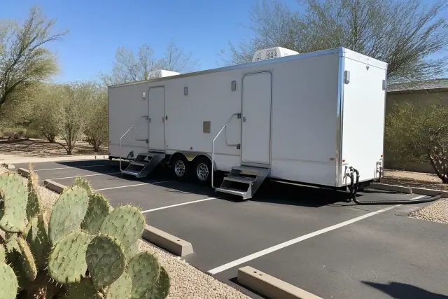 Luxury restroom trailer installed on a paved construction site in Phoenix, AZ.