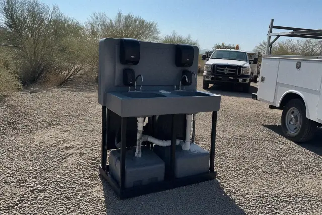 Sensor-activated handwashing station installed on a gravel worksite in Phoenix, AZ.