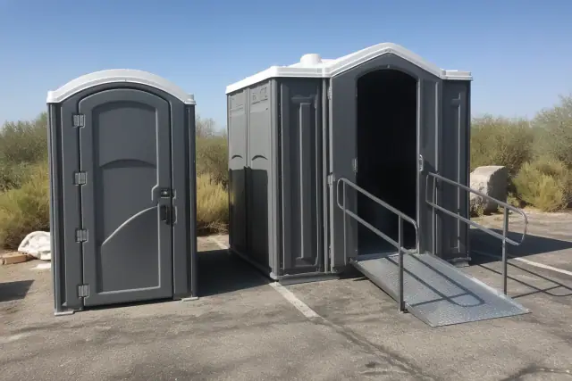Standard and ADA-compliant portable restrooms sitting side by side on an asphalt parking lot in Phoenix, AZ.