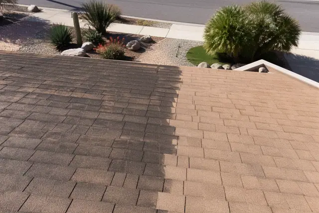 Asphalt shingle roof showing cleaned areas and algae streaks in a xeriscaped front yard in Phoenix, AZ.