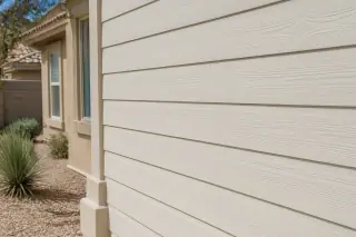 Brightly cleaned residential siding against xeriscaped desert landscaping in Phoenix, AZ.