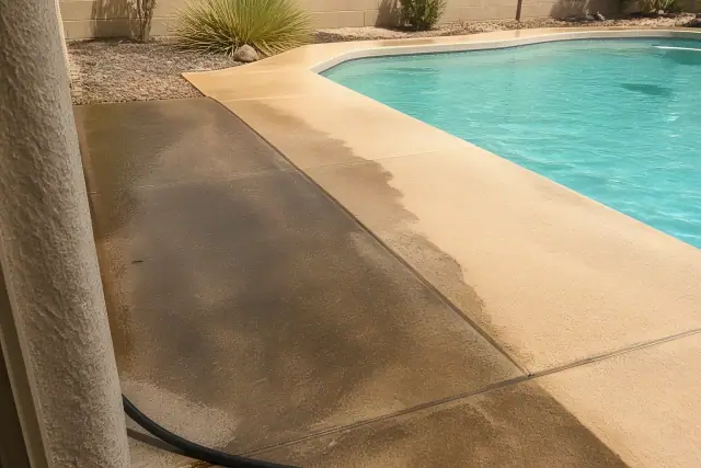Concrete pool deck showing the difference between stained and cleaned surfaces at a home in Phoenix, AZ.