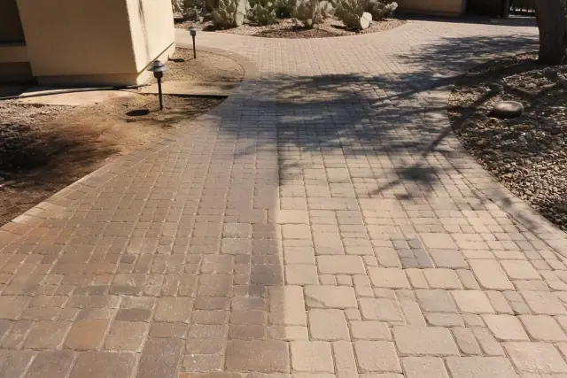 Interlocking stone pavers during a cleaning and sealing project in Gilbert, AZ.