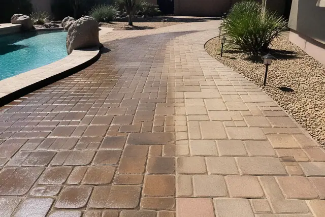 Cleaned stone pavers and brick on a pool deck and patio in Phoenix, AZ.
