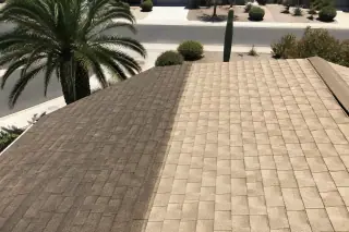 Cleaned asphalt shingles showing the contrast between algae streaks and the original roof color in Phoenix, AZ.