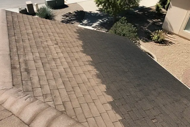 Asphalt roof shingles in Phoenix, AZ, showing the difference between black algae stains and the cleaned surface.
