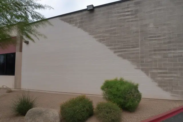 Cleaned brick masonry alongside weathered brick on a commercial building in Phoenix, AZ.