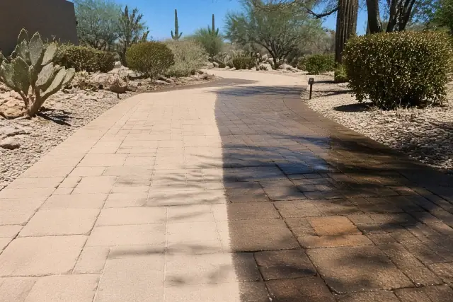 Travertine paver sealing on a residential walkway in Phoenix, AZ, showing the finish contrast with cacti in the background.
