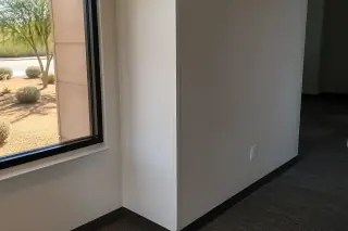 Finished metal stud wall partitions with gypsum panels and corner beads in a Phoenix, AZ commercial office.