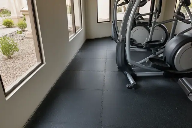 Interlocking rubber gym floor tiles installed in a commercial office space in Surprise, AZ.