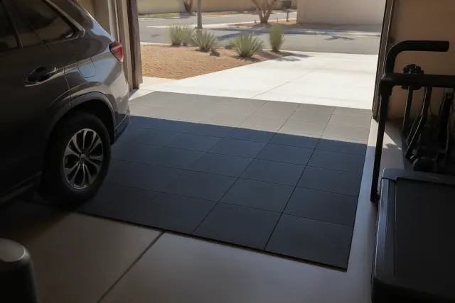 Rubber tiles, rolls, and mats installed on a concrete garage gym floor in Phoenix, AZ.