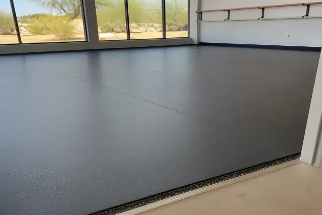 Commercial rubber dance studio flooring with acoustic underlayment installed in Phoenix, AZ.