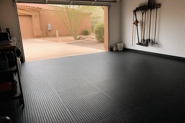 Perforated rubber floor tiles installed in a residential garage in Phoenix, AZ.
