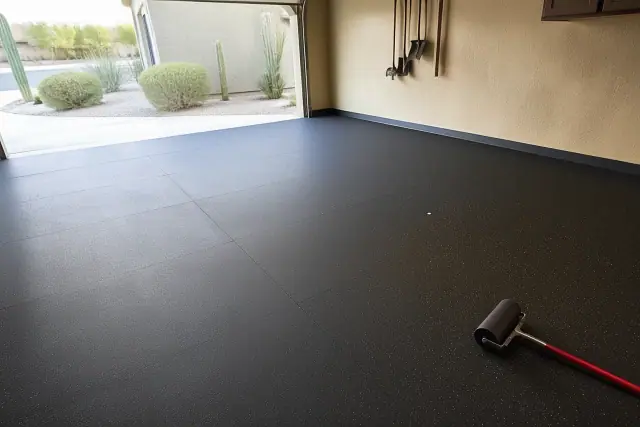 Black rubber anti-fatigue flooring rolls installed on a residential garage floor in Phoenix, AZ.