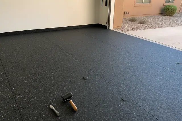 Rolled rubber flooring installed in a residential garage workshop in Phoenix, AZ.