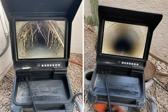 Sewer camera monitor showing pipe conditions and tree roots during an inspection in Phoenix, AZ.