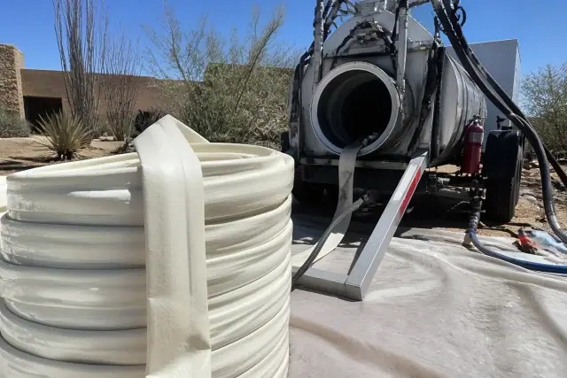Resin-coated liner and hydraulic inversion machine for CIPP sewer pipe lining at a jobsite in Phoenix, AZ.