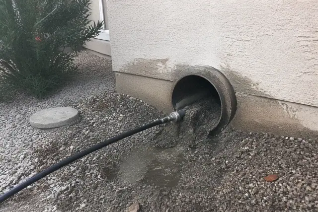 Hydro-jetting equipment clearing debris from a drain pipe at a jobsite in Surprise, AZ.