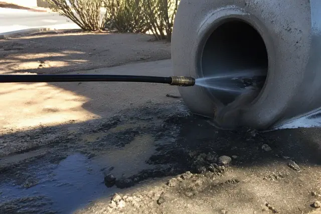 Hydro-jetting nozzle cleaning an industrial sewer pipe at a job site in Phoenix, AZ.
