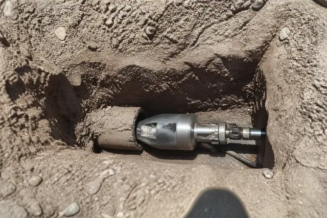 Hydraulic bursting head in a trenchless pipe replacement pit at a jobsite in Tempe, AZ.