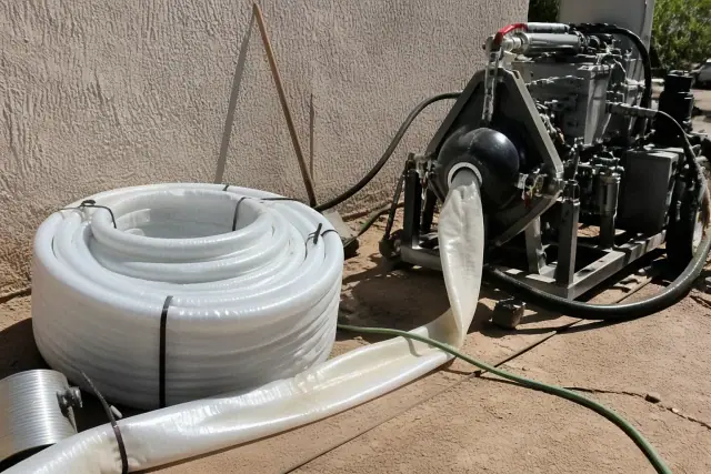 Resin coated liner and hydraulic inversion machine for sewer pipe lining in a Glendale, AZ jobsite.