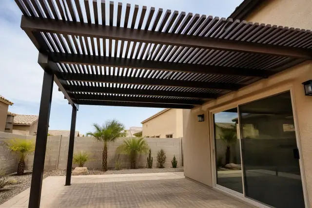 Aluminum and Alumawood pergola installed over a paved residential patio in Phoenix, AZ.
