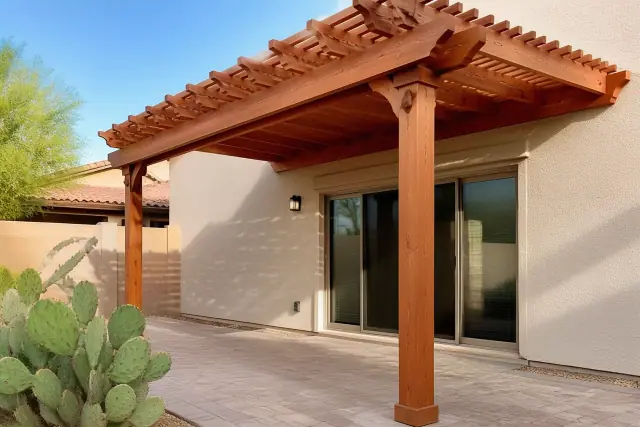 Cedar and redwood pergola installed over a paved backyard patio in Phoenix, AZ.