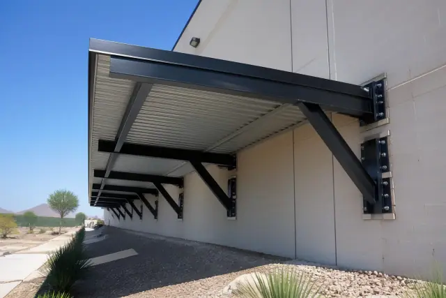 Commercial metal awnings installed above a warehouse loading dock in Phoenix, AZ.