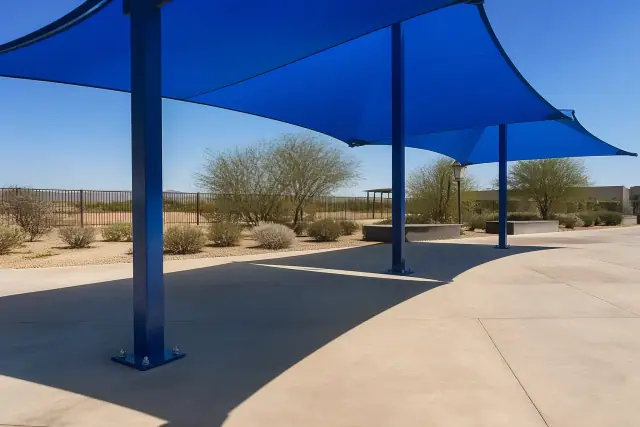 Commercial shade structures with tensioned fabric panels installed on a pool deck in Glendale, AZ.