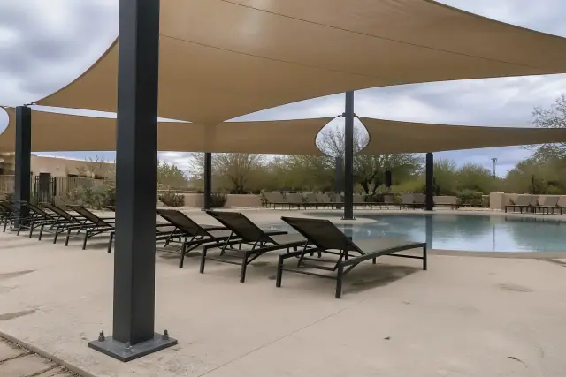 Commercial shade structures installed over a pool deck at a facility in Gilbert, AZ.
