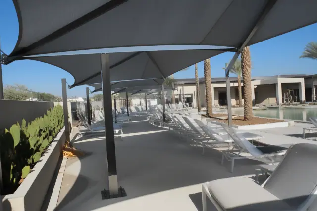 Steel shade structure supports installed on a commercial pool deck in Chandler, AZ.