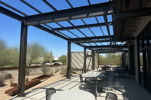Structural steel framework for a patio shade installation at an outdoor dining terrace in Phoenix, AZ.