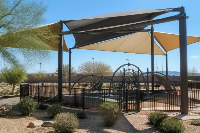 Fabric shade structures over playground equipment at a park in Phoenix, AZ.
