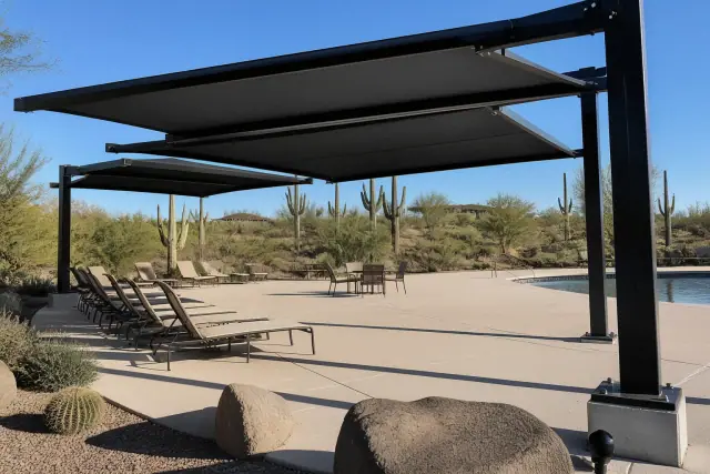 Industrial cantilever shade structures over a commercial pool deck in Phoenix, AZ.