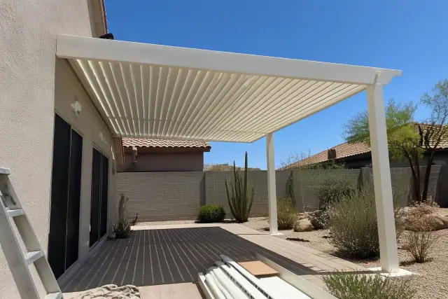 Louvered roof installation over a paved residential patio in Phoenix, AZ.