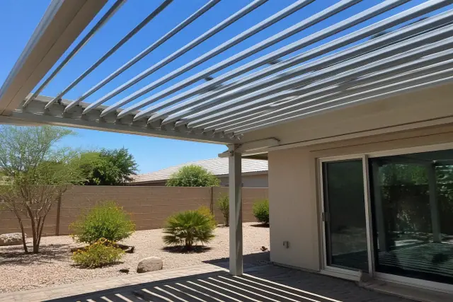 Adjustable aluminum louvered roof system installed over a residential patio in Phoenix, AZ.