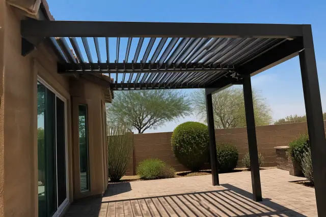Motorized louver system over a backyard patio with desert landscaping in Phoenix, AZ.