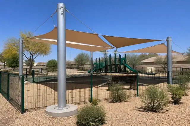 Galvanized steel playground shade posts and canopy cables installed at a public park in Surprise, AZ.