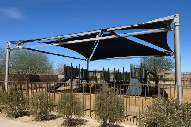 Tensioned fabric shade structures over playground equipment at a public park in Queen Creek, AZ.