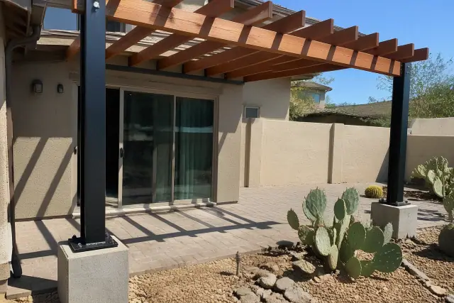 Steel support posts and timber rafters for a new shade structure at a home in Chandler, AZ.