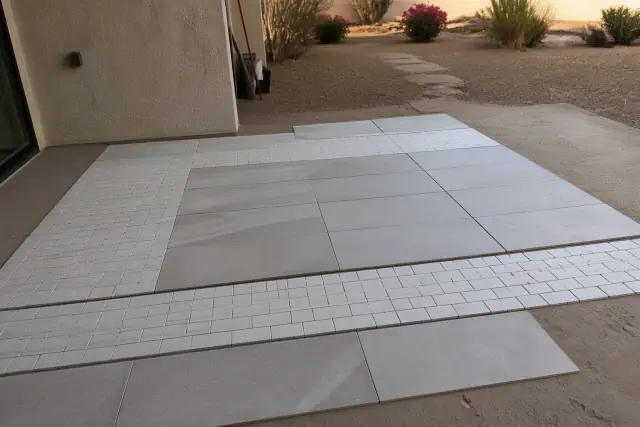 Dry layout of 3x6 subway tiles and 12x24 tiles on a floor in Phoenix, AZ.