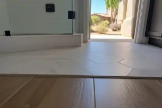 Tile floor meeting a wood floor transition strip in a Phoenix, AZ home.