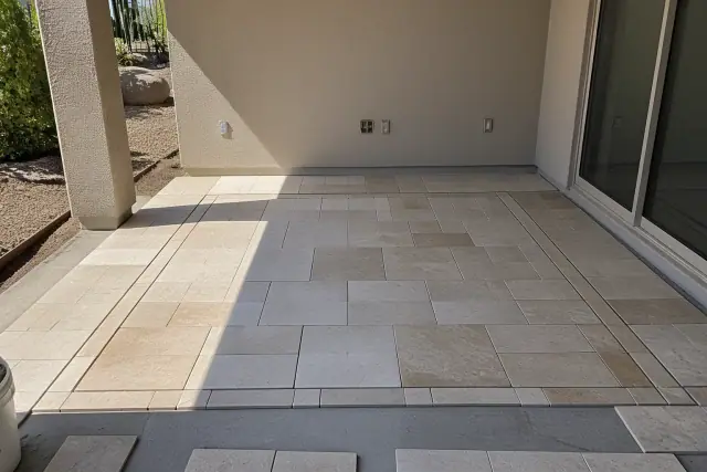 Dry-fit tile arrangement showing centered layout and cuts at a job site in Phoenix, AZ.