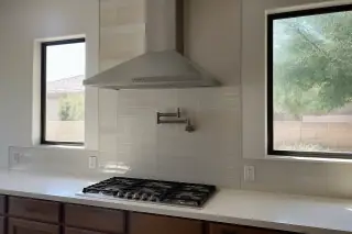 Finished kitchen backsplash with grout lines and edge trim in a Phoenix, AZ home.