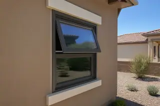 Casement and awning windows installed in a stucco home in Phoenix, AZ, overlooking a desert xeriscape yard.