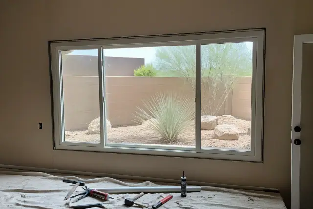 Sliding window frame installation in progress on a residential jobsite in Gilbert, AZ.